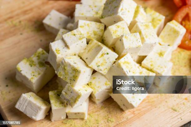 Sliced White Cottage Cheese With Spices Stock Photo - Download Image Now - Appetizer, Breakfast, Cheese