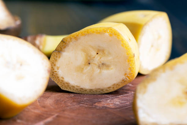 istock Sliced ripe yellow banana, close up 1517081798