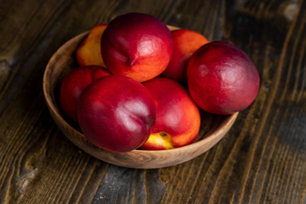istock Nectarines folded in a wooden bowl 1517083492