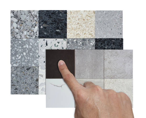 istock architect's hand selects multicolored and texture of square shapes terrazzo artificial stone samples and porcelain ceramic stone tile samples isolated on background with clipping path. 1517106141