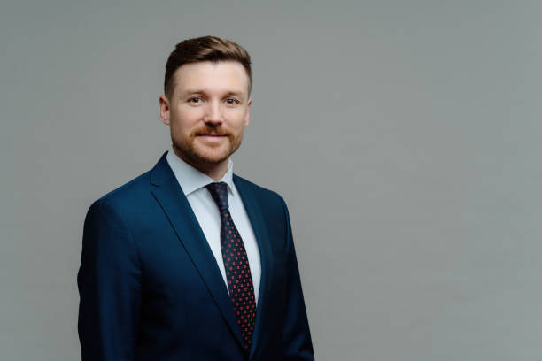 istock Confident male CEO, good reputation, smart at work, isolated on grey studio background with copy space. Charismatic employer indoors. 1517123234