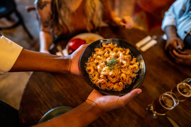 istock Waiter serving food at a restaurant 1517138625