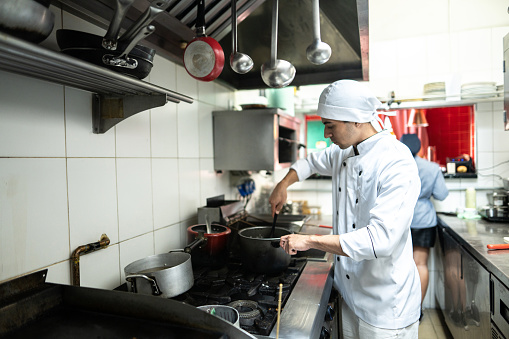 Blurred chef working in kitchen