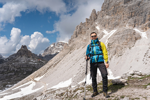 Portrait of a proud Caucasian man, during his hike through the Dolomites