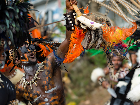 Cruz Bay, St John/US Virgin Islands-July 04, 2023: Fourth of July Carnival celebration in Cruz Bay, Tribal war dance in the street