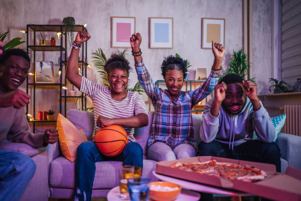 istock Friends watching basketball game at home 1517183906