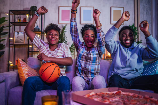 istock Friends watching basketball game at home 1517184523