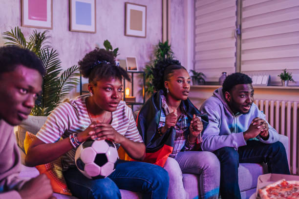 istock Friends watching a soccer match at home 1517187301