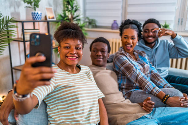 istock Cheerful friends taking a selfie at home 1517198586