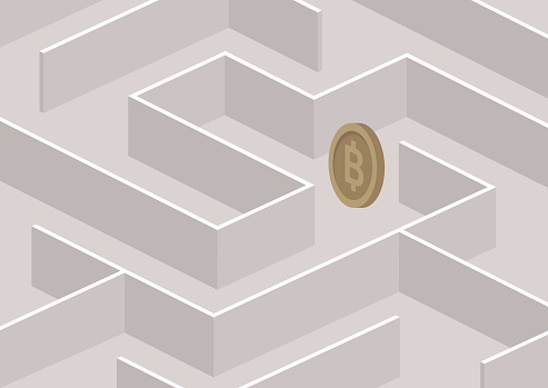 A bitcoin coin hidden between the labyrinth walls