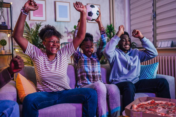 istock Friends watching a soccer match at home 1517204151