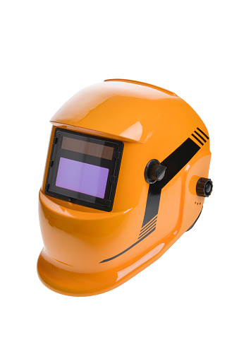 Casco de máscara de soldadura naranja sobre fondo blanco photo