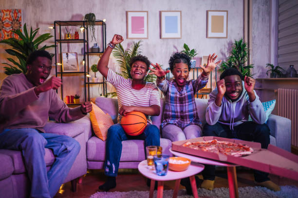 istock Friends watching basketball game at home 1517207307