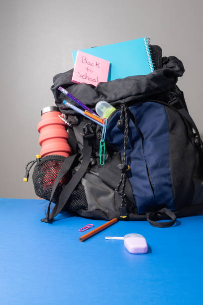 istock Back to school concept with blue and black book bag backpack 1517225009