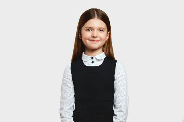 istock Cute girl in school uniform smiling and feeling confident while being best student in class 1517243099