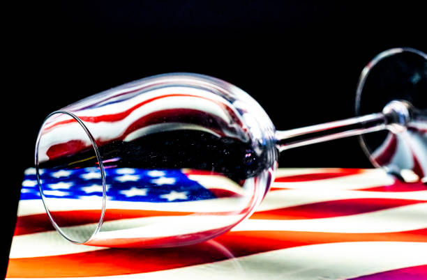 istock Empty Wine Glass On The American 'Stars & Stripes' Flag 1517259681