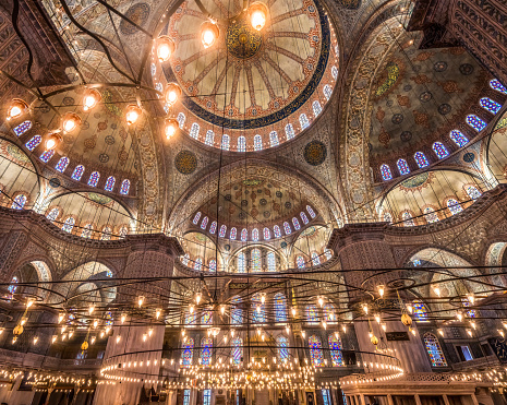 Blue Mosque Electric Lights Basilica Domes Stained Glass Istanbul Turkey. Blue Mosque or Sultan Ahmed Mosque built in 1616 by Ottoman Turks. Mosques no pictures of human beings so Islamic decorations with flowers