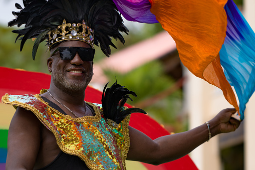 Cruz Bay, St John/US Virgin Islands-July 04, 2023: Fourth of July Carnival celebration in Cruz Bay, Costumed Carnival King parading through the street in Cruz Bay.