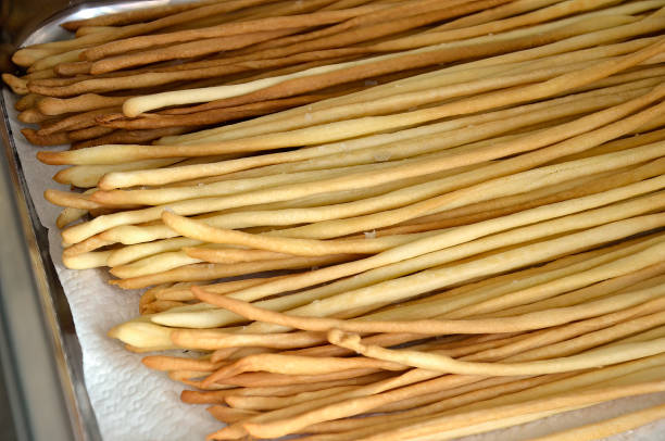 istock Tray with freshly baked breadsticks 1517346271
