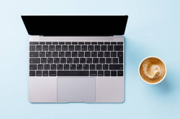 istock Office desk table with laptop and cup of coffee 1517350653