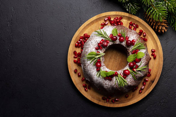 istock Christmas cake with pomegranate seeds, cranberries and rosemary 1517358210