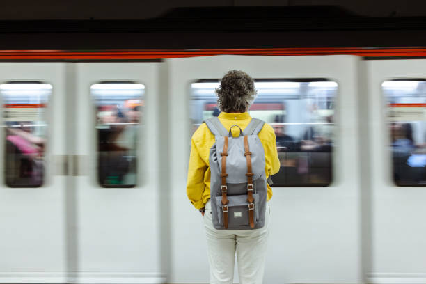 istock Senior man with backpack is waiting for a train in metro 1517372397