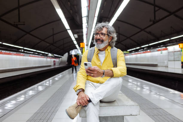 Senior man waiting for a train stock photo