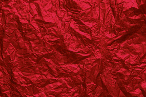 istock Red crumpled texture background. Abstract banner with shine red.  Flat lay mockup design. Craft paper texture sheet abstract background, wrapping texture. 1517379388