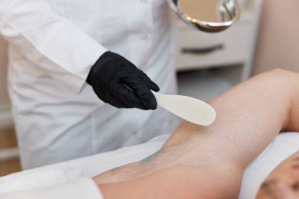 istock young man undergoes procedure of arm pit laser epilation 1517426505