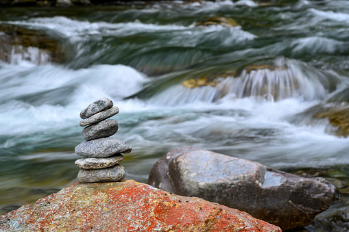 A stack of stones beside a river