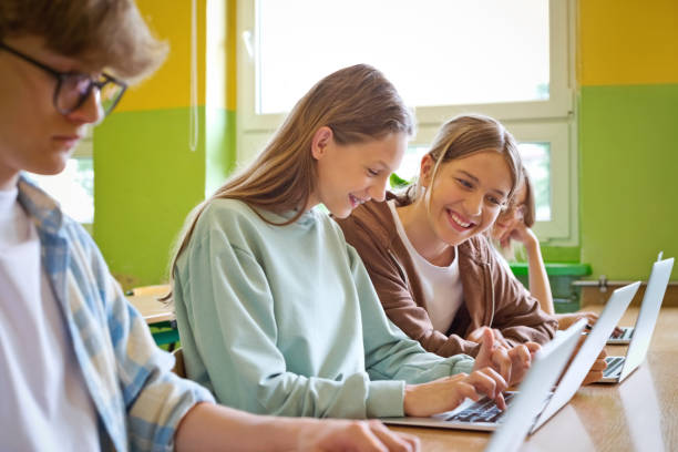 istock Teenagers using laptops in the classroom 1517465556