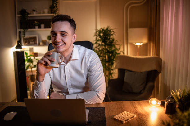 istock A young man who works from home at night, does his work when it is calm and quiet around him 1517487162