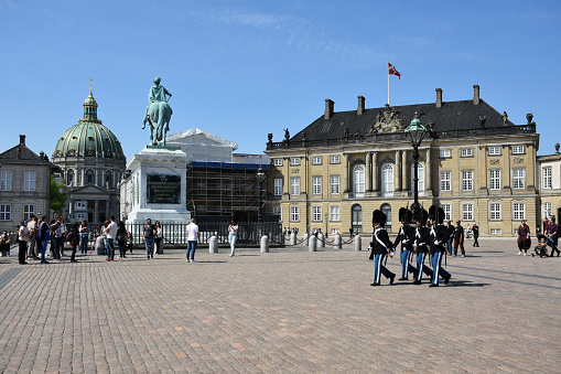 Copenhagen, Denmark - May 14, 2023: Amalienborg Palace, Equestrian Statue Of Frederick V, Amalienborg Palace Change Of Guards, People Walking, Taking Picture During Springtime In Scandinavia Northern Europe