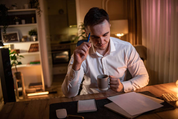 istock A young man who works from home at night, does his work when it is calm and quiet around him 1517530215
