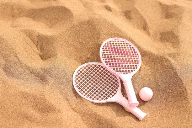 istock Beach tennis set on sand, summer activity sport 1517645926