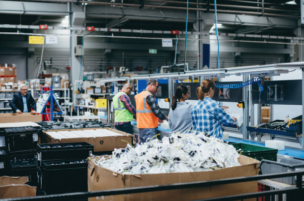 istock Manuel workers team work on production line with screw tool at factory 1517776791