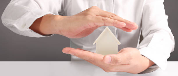 istock House Residential Structure in hand ,business home idea 1517831265