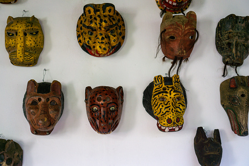 Mayan wooden, handcrafted masks on market for sale in Chichicastenango, Guatemala