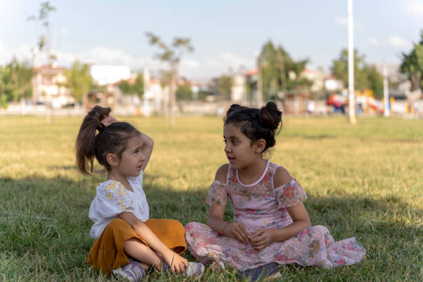 Children outdoors. Cute little girl chatting