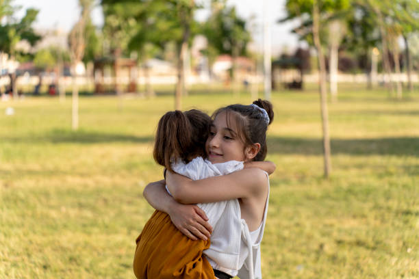istock Girls spending time in a green field. 1517984840