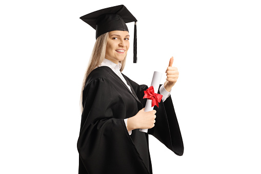 Female graduate student holding a diploma and gesturing thumbs up isolated on white background