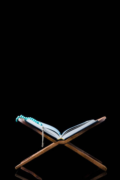 istock The Holy Al Quran with written Arabic calligraphy 1518101746