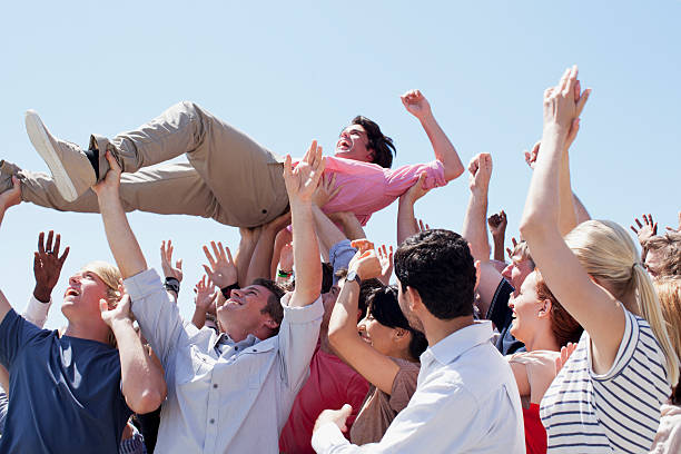 Man crowd surfing  mosh pit stock pictures, royalty-free photos & images