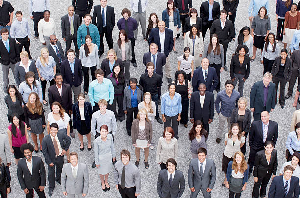 Portrait of business people in crowd  looking up photos stock pictures, royalty-free photos & images