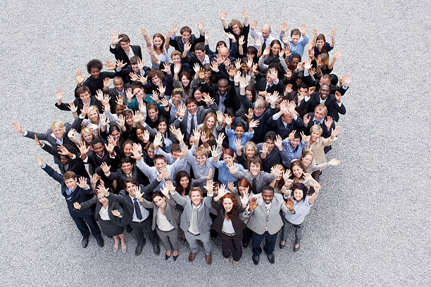Portrait of waving business people  large group of people facing camera stock pictures, royalty-free photos & images