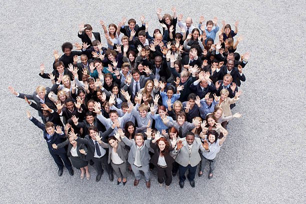 Portrait of waving business people  arms raised women business full length stock pictures, royalty-free photos & images