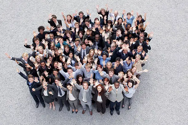 Photo of Portrait of waving business people