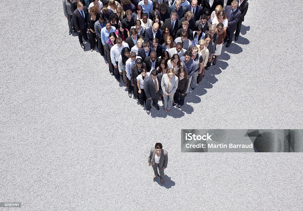 Businesswoman at apex of crowd  Leadership Stock Photo