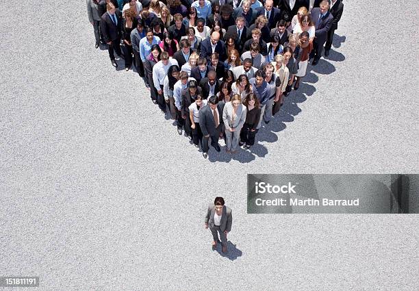 Businesswoman At Apex Of Crowd Stock Photo - Download Image Now - Leadership, Authority, Responsibility