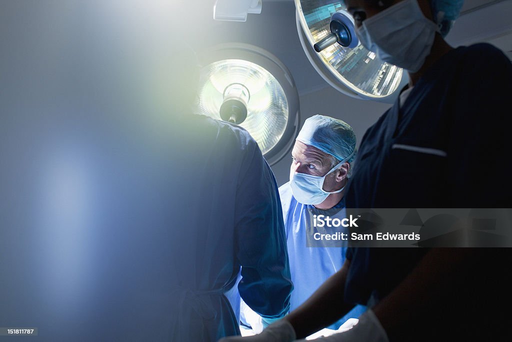 Surgeons working in operating room  Surgery Stock Photo